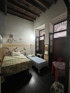Ένα ή περισσότερα κρεβάτια σε δωμάτιο στο Hostel Torre Bahia