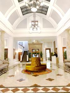 a lobby with a fountain in the middle of a building at Taj Cape Town - private luxury 5 star suites - very spacious with kitchenette in Cape Town