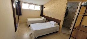 Sleep Suites客房内的一张或多张床位