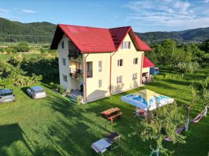 an aerial view of a house with a red roof at Vila Norina in Oeşti-Pămînteni
