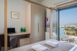 A bed or beds in a room at Elysium Seaview Oasis