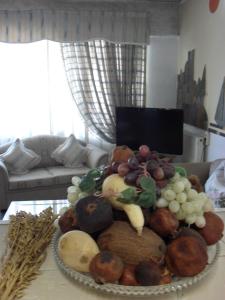 a pile of fruits and vegetables on a table at La Santre Villa in Amoudara Herakliou