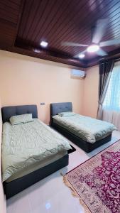 Llit o llits en una habitació de BUNGALOW D'CENANG- Private Pool