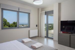 A bed or beds in a room at Elysium Seaview Oasis
