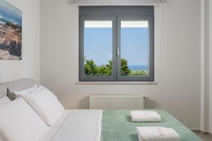 A bed or beds in a room at Elysium Seaview Oasis