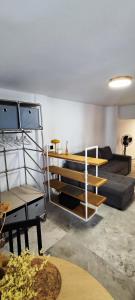 a living room with a couch and a table at Estudio de Lujo in Torrevieja