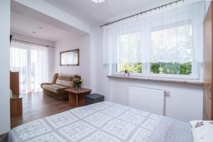 Postel nebo postele na pokoji v ubytování Dom Wczasowy Klif & Spa