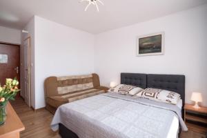 Postel nebo postele na pokoji v ubytování Dom Wczasowy Klif & Spa