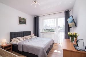 Postel nebo postele na pokoji v ubytování Dom Wczasowy Klif & Spa