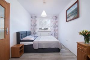 Postel nebo postele na pokoji v ubytování Dom Wczasowy Klif & Spa