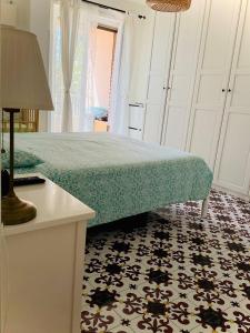 A bed or beds in a room at Residenza Gli Oleandri