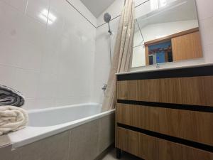 a bathroom with a bath tub and a sink at Duplex en centro de calella in Calella