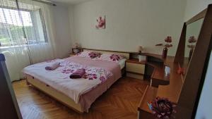 Postel nebo postele na pokoji v ubytování Apartman CELIJA