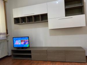 a television sitting on a table in a room at Gabe in Cesena