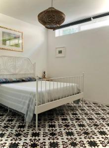 A bed or beds in a room at Residenza Gli Oleandri