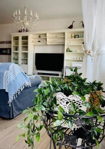 A television and/or entertainment centre at Residenza Gli Oleandri