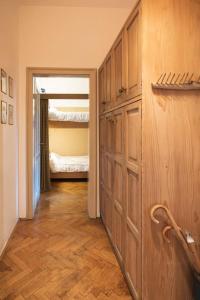 a hallway with a room with a bed and a closet at ROMANTICO BILOCALE CON PANORAMA MOZZAFIATO in Nova Levante