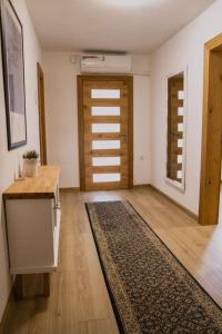 an empty room with a door and a rug at Apartman "EXCLUSIVE" in Bihać