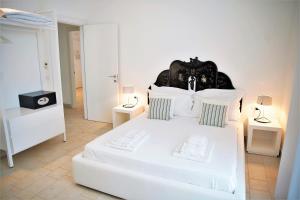 Postel nebo postele na pokoji v ubytování Castello Tafuri