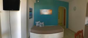 a room with a bed in the corner of a room at Villa Dacla in Lampedusa