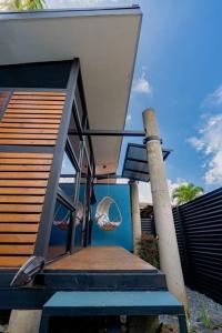 a staircase leading to a house with a balcony at Olly´s House in Turrialba