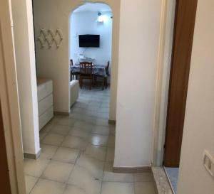 a hallway leading to a living room with a table at Villa Dacla in Lampedusa