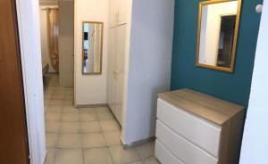 a hallway with a mirror and a dresser in a room at Villa Dacla in Lampedusa