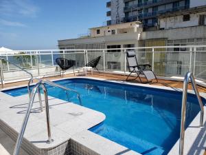 a swimming pool on the roof of a building at South beach residence copacabana in Rio de Janeiro