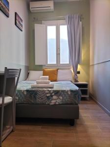 Postel nebo postele na pokoji v ubytování Hotel Camilla Guelfa
