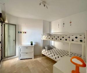 A bed or beds in a room at Carboneras - Holidays Time
