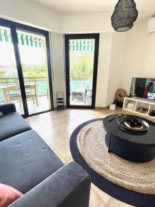 a living room with a couch and a table at Appartement Plage et Nature in Saint-Raphaël