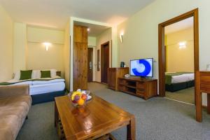 Katil atau katil-katil dalam bilik di Musala Hotel