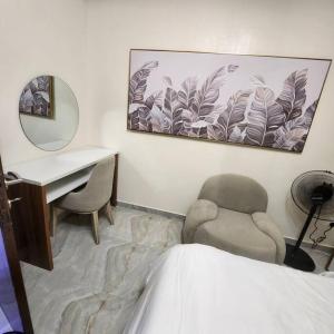 Postel nebo postele na pokoji v ubytování Staycation Loft, Lekki Phase 1