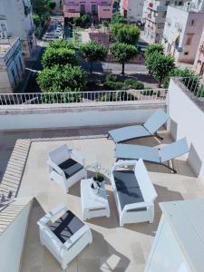 a group of chairs and tables on a roof at Dimora Storica Il Tiglio in Castellana Grotte