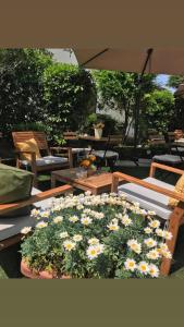 a table with a bunch of flowers on it at B&B Magnolia in Verona