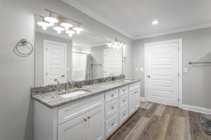 a bathroom with a sink and a large mirror at Lookout Escape - Top of Lookout Mountain in Lookout Mountain +41 photos