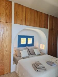 Postel nebo postele na pokoji v ubytování Tilos Villa