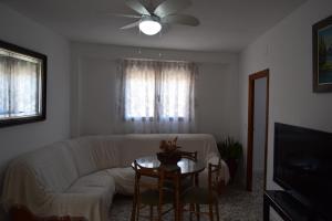 a living room with a couch and a table at CASA DEL RIO in Castril