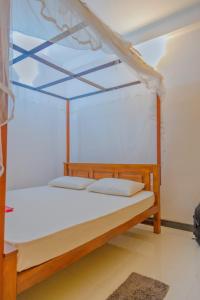 Postel nebo postele na pokoji v ubytování Talalla Ocean Beach Bungalow