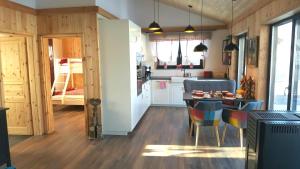 a kitchen and dining room with a table and chairs at Vogelsberger Zirbenstüberl in Grebenhain