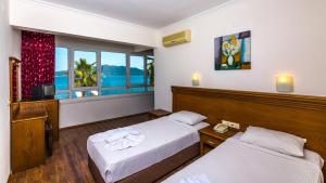 Tempat tidur dalam kamar di Honeymoon Beach Marmaris