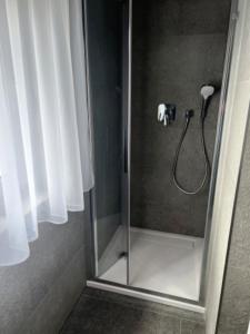 a shower with a glass door in a bathroom at Apartmán - Dolní Morava - "Sedmička" pro 2 až 6 osob in Dolní Morava