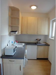 a kitchen with a white stove and a sink at WonderFlat for Wonderful people in Berlin