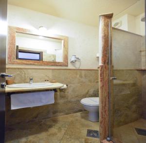 a bathroom with a sink and a toilet and a mirror at Hotel Villa Perla Di Mare in Budva +37 photos