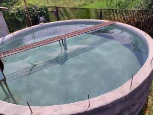 a large swimming pool in around at Welcome Guest House in Tokmok