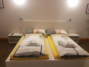 two beds sitting on a platform in a room at good bed Bettenhausen in Oberönz