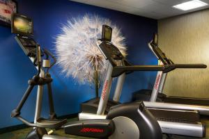 a gym with two exercise bikes in a room at SpringHill Suites Dallas DFW Airport North/Grapevine in Grapevine