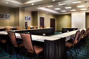 a conference room with a long table and chairs at SpringHill Suites Dallas DFW Airport North/Grapevine in Grapevine