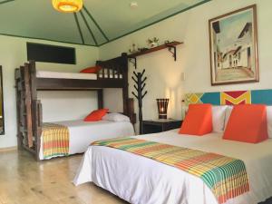 Postel nebo postele na pokoji v ubytování Mamatina Hotel