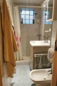 a bathroom with a toilet and a sink and a shower at Naturist B&B The Little Paradise in Morville +40 photos